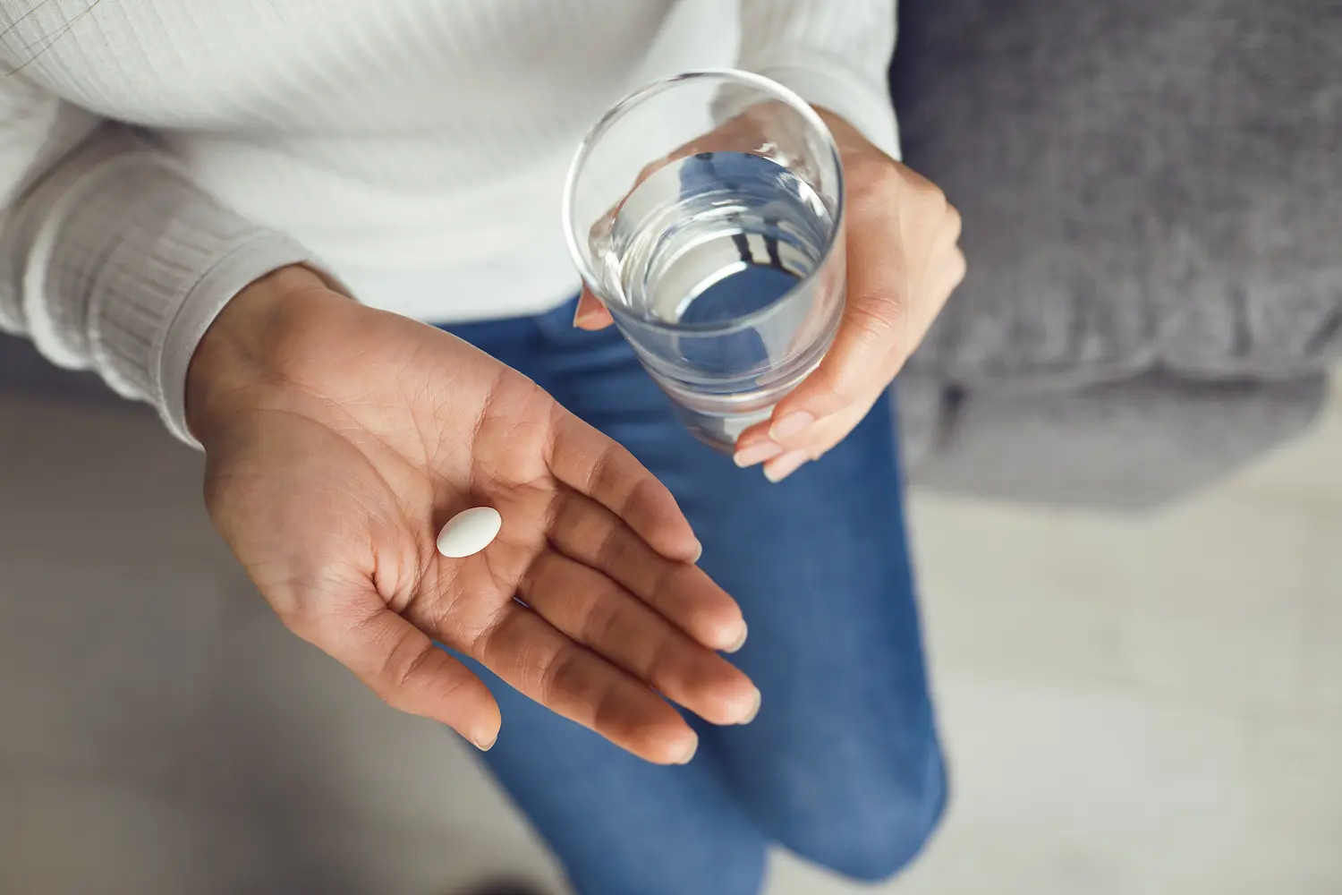 supplement pill in a person's hand